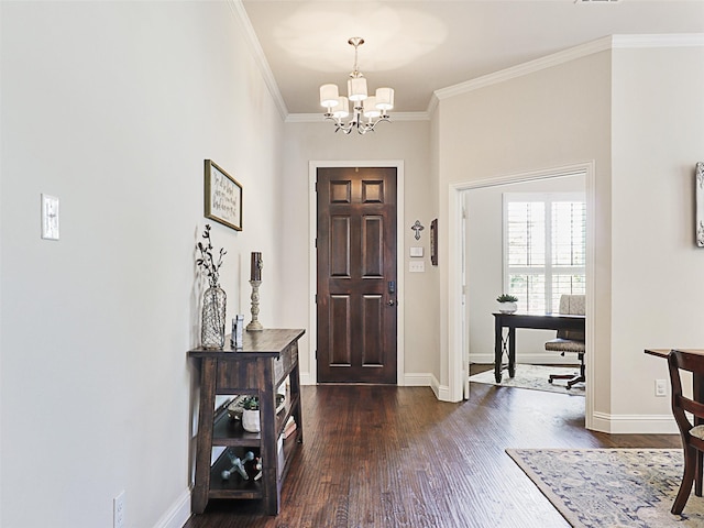 foyer with an inviting chandelier, dark hardwood / wood-style floors, and crown molding