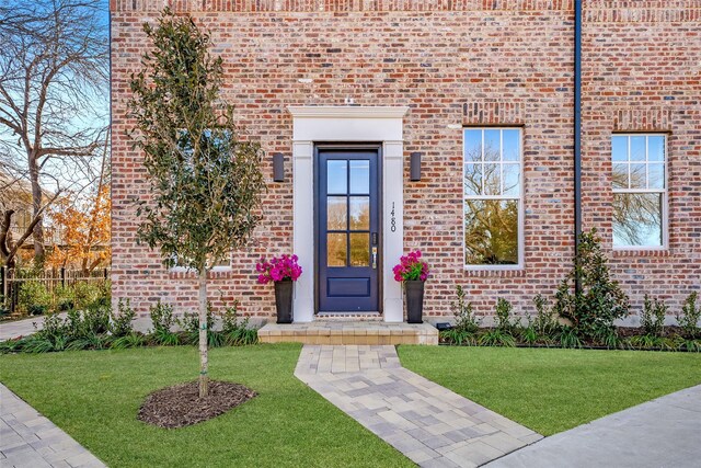 doorway to outside with light wood-type flooring and a wealth of natural light