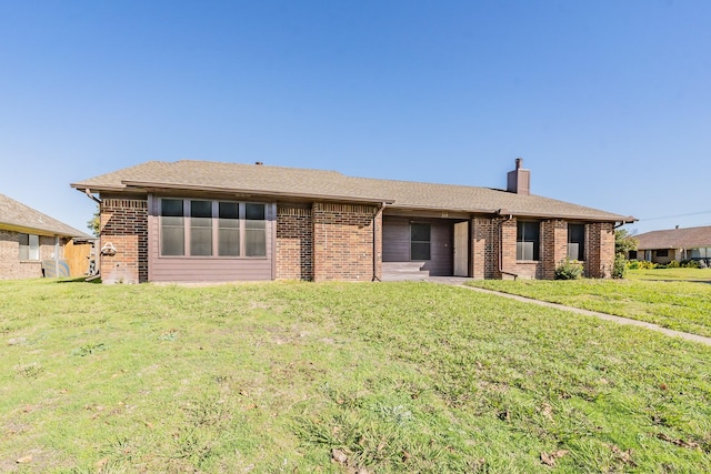 single story home with a front yard