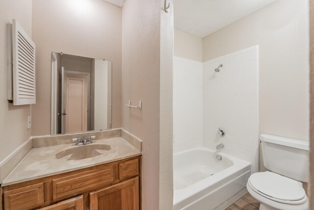 full bathroom featuring toilet, vanity, and shower / bathing tub combination