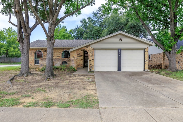 ranch-style home with a garage