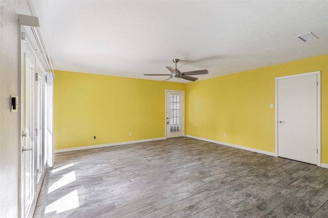 unfurnished room with ceiling fan and wood-type flooring