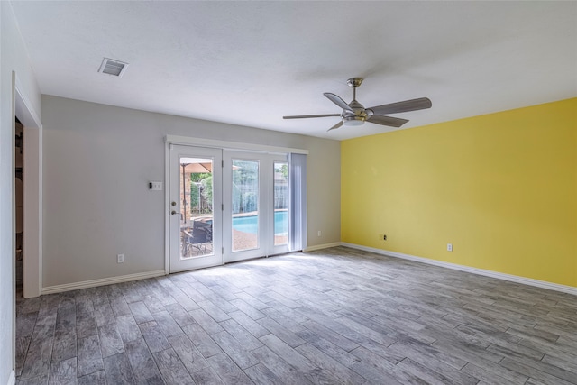 unfurnished room featuring light hardwood / wood-style flooring and ceiling fan