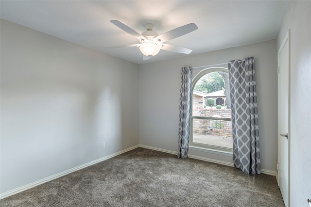 spare room featuring carpet flooring and ceiling fan