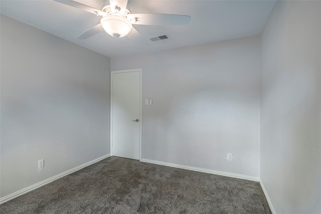 unfurnished room featuring ceiling fan and dark colored carpet