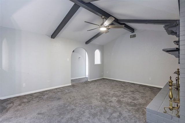 unfurnished living room with lofted ceiling with beams, dark colored carpet, and ceiling fan