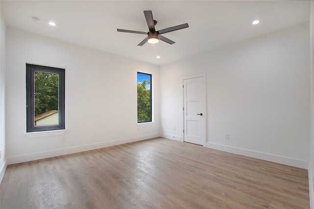 empty room with recessed lighting, baseboards, light wood-style floors, and ceiling fan