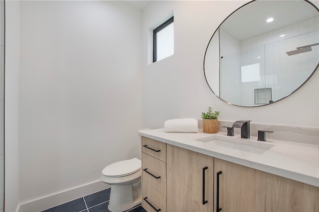 bathroom featuring tile patterned floors, walk in shower, toilet, and vanity