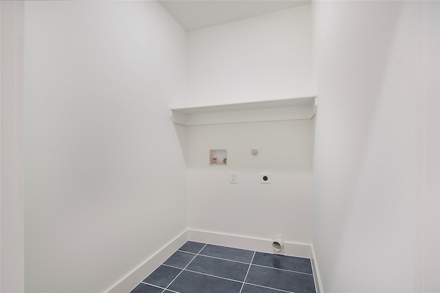 laundry area featuring hookup for an electric dryer, baseboards, dark tile patterned flooring, laundry area, and washer hookup