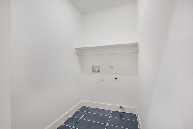 laundry room with dark tile patterned flooring, hookup for a washing machine, hookup for an electric dryer, and hookup for a gas dryer