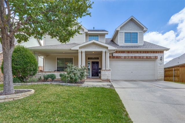 craftsman inspired home with a porch, a garage, and a front yard