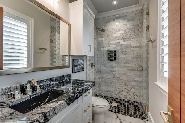 bathroom featuring ornamental molding, vanity, toilet, and walk in shower