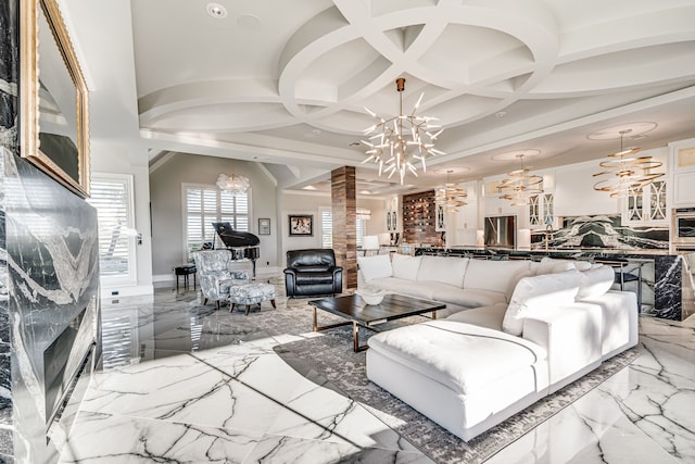 living room with coffered ceiling, an inviting chandelier, and beam ceiling