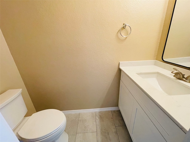 bathroom with hardwood / wood-style floors, toilet, and vanity