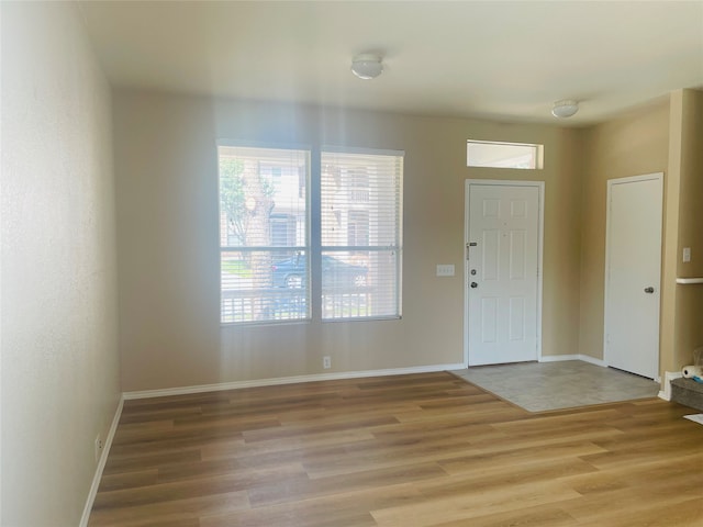 foyer entrance with hardwood / wood-style floors