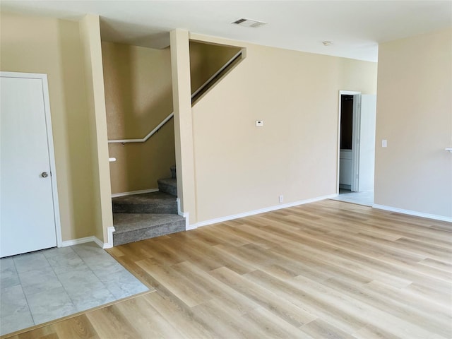 unfurnished living room featuring light wood-type flooring