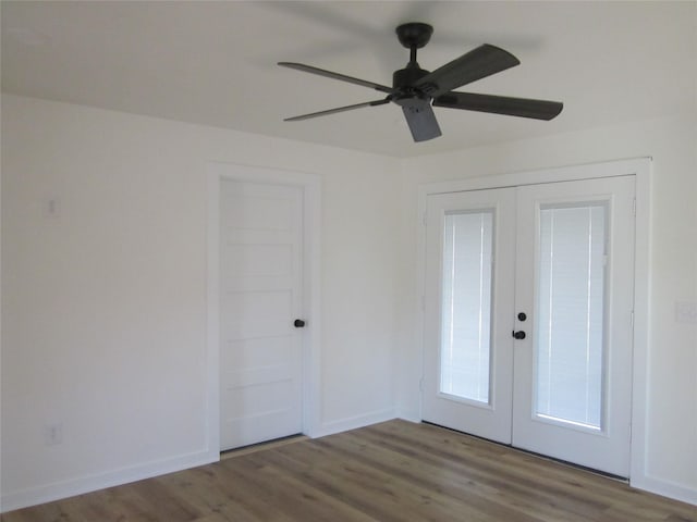 interior space with french doors, baseboards, ceiling fan, and wood finished floors
