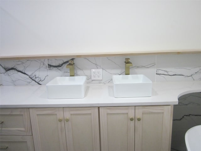 interior space with decorative backsplash and vanity