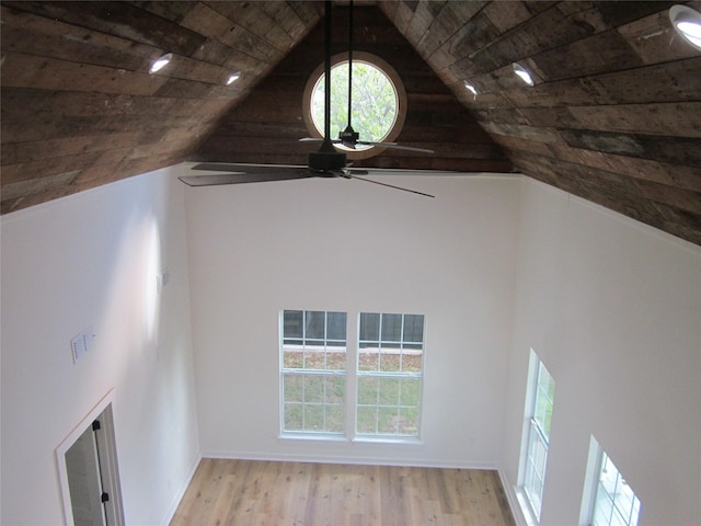 interior space featuring wood ceiling, ceiling fan, wood finished floors, and vaulted ceiling