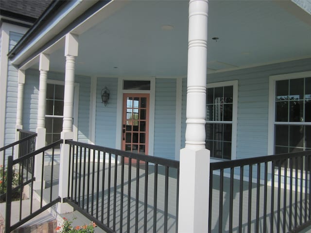 entrance to property featuring a porch