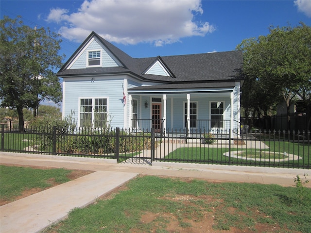 view of front of property featuring covered porch and a front lawn