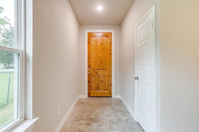 interior space featuring light carpet