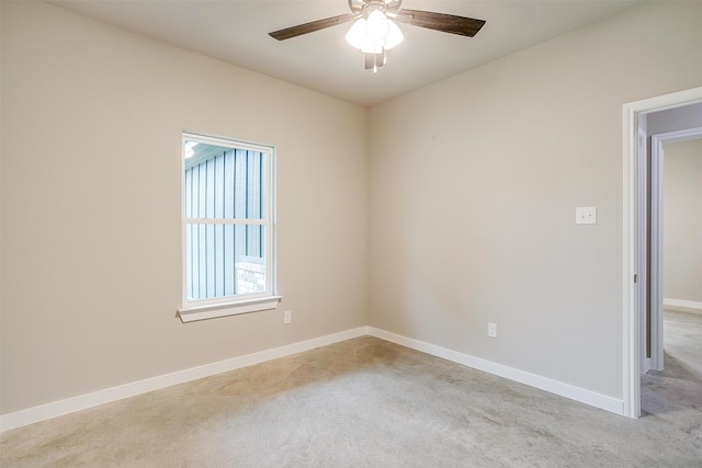 empty room featuring light carpet and ceiling fan