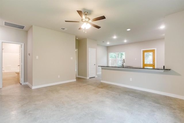 empty room with sink and ceiling fan