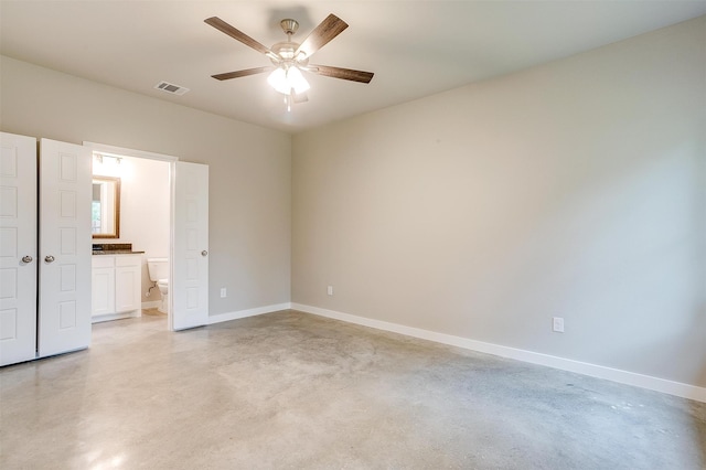 unfurnished bedroom with connected bathroom and ceiling fan