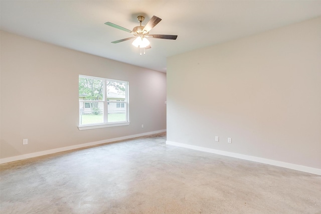 spare room featuring light carpet and ceiling fan