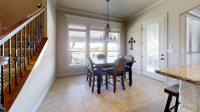 dining space with crown molding, light tile patterned floors, and a chandelier