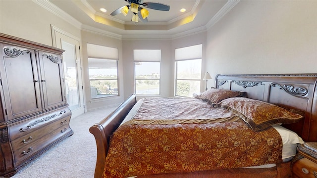 bedroom with ceiling fan, access to outside, a tray ceiling, light carpet, and crown molding