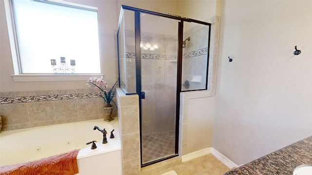 bathroom featuring separate shower and tub and a wealth of natural light