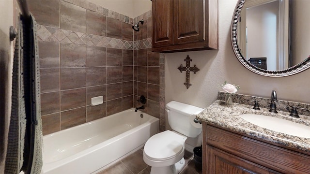 full bathroom featuring vanity, toilet, shower / bath combo with shower curtain, and tile patterned floors