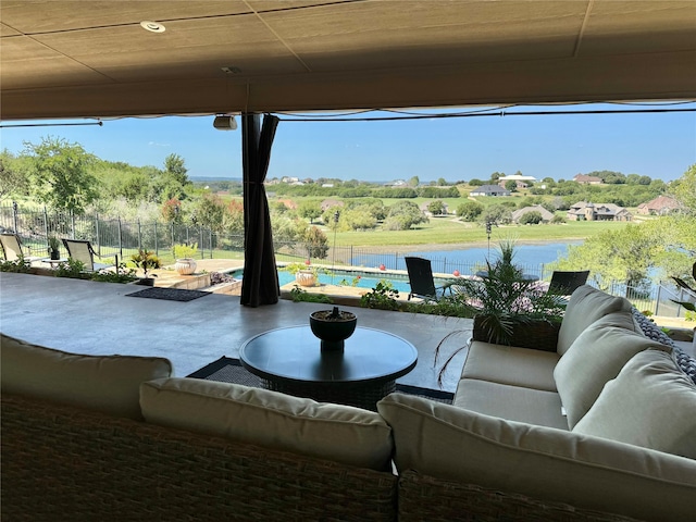 view of patio with an outdoor hangout area and a water view