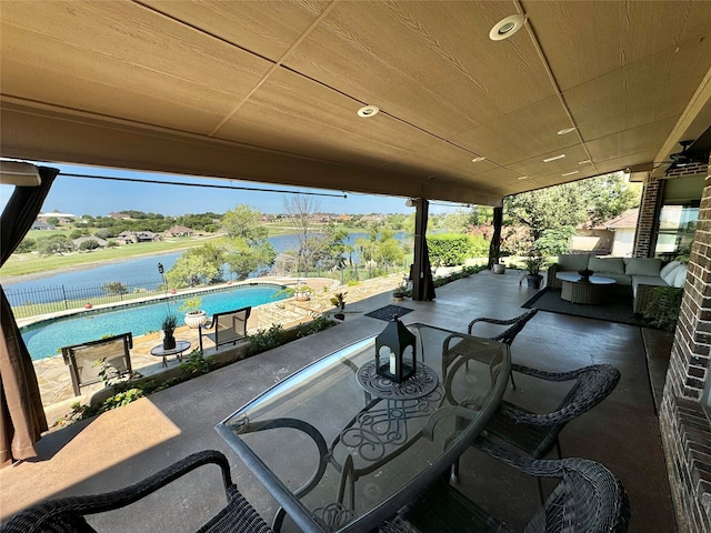 view of patio featuring a water view