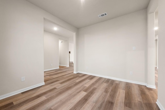 empty room with light hardwood / wood-style floors