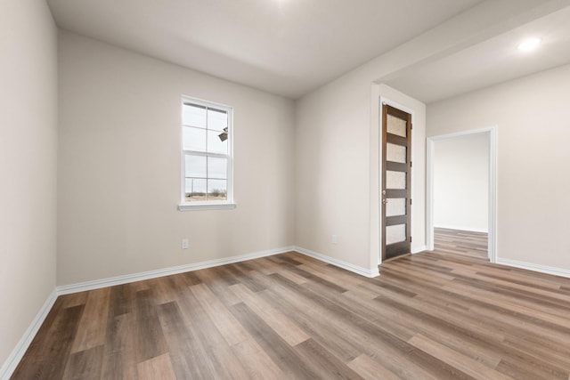 spare room featuring hardwood / wood-style flooring