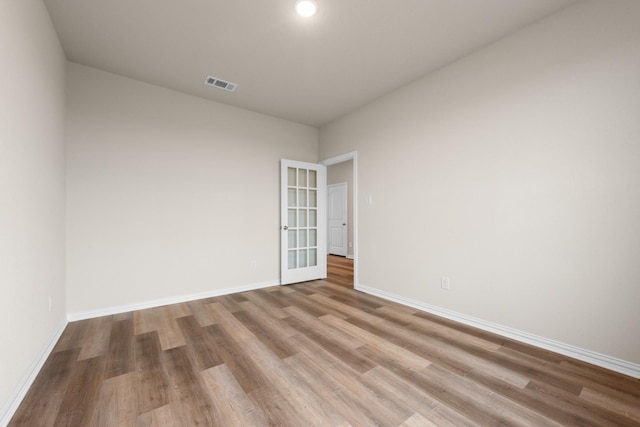 spare room featuring light wood-type flooring