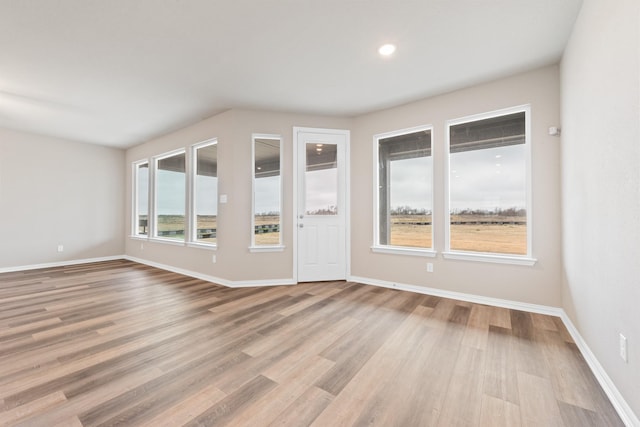 empty room with light wood-type flooring