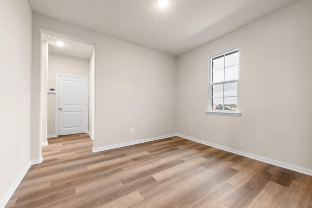 empty room with light hardwood / wood-style floors