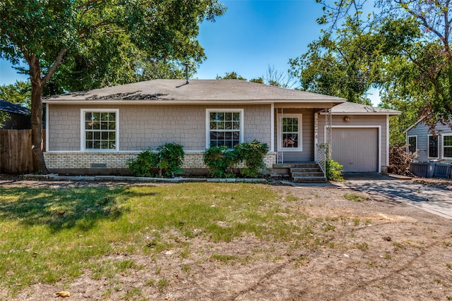 ranch-style house with a garage and a front lawn