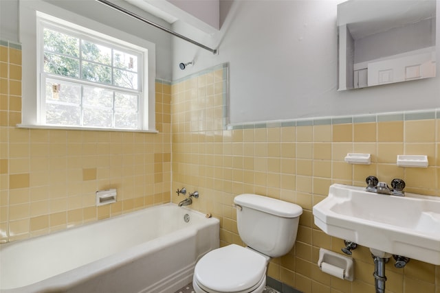 full bathroom with tile walls, toilet, sink, and backsplash