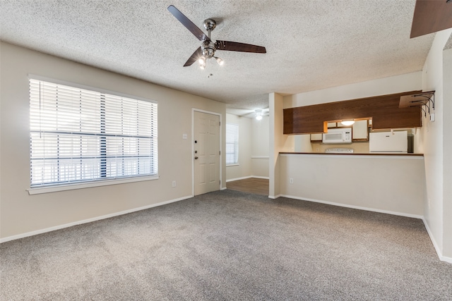 unfurnished living room with a textured ceiling, carpet, and ceiling fan