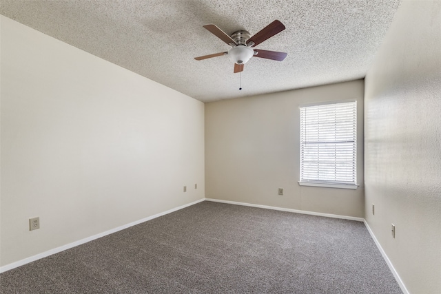 spare room featuring ceiling fan, a textured ceiling, and carpet