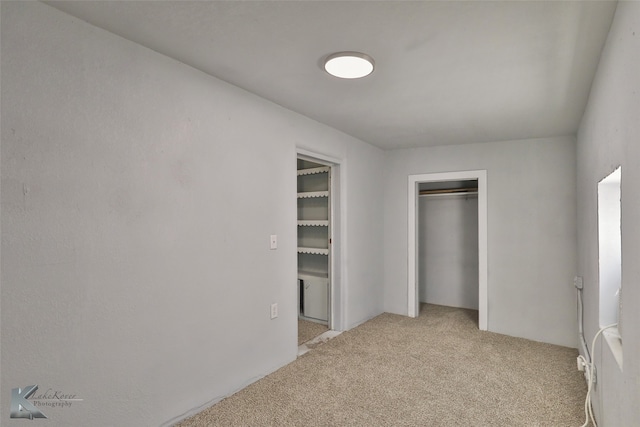 unfurnished bedroom featuring light colored carpet