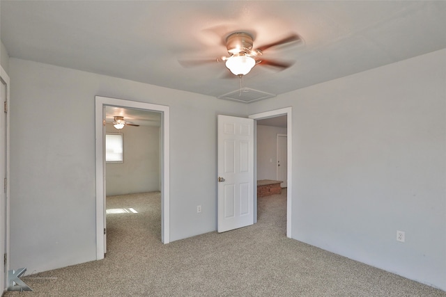 unfurnished bedroom featuring light colored carpet and ceiling fan