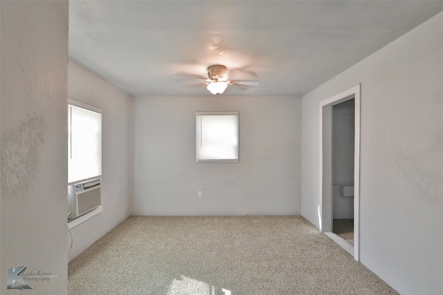 unfurnished room featuring ceiling fan, light colored carpet, and a healthy amount of sunlight