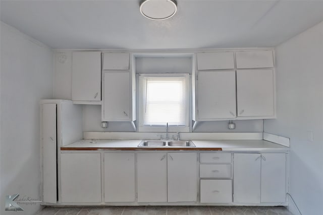 kitchen with white cabinets and sink