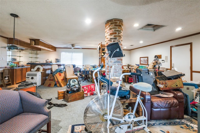 interior space featuring carpet flooring, ceiling fan, crown molding, and a textured ceiling